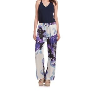 Trina Turk purple floral polyester pull on pants.